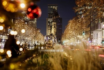 The Christmassy illuminated Kurfürstendamm in Berlin with the Memorial Church 