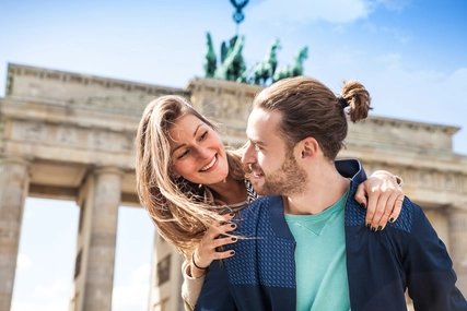Beautiful couple celebrating in Berlin - Brandenburg Gate