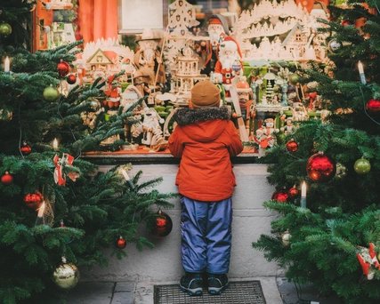 Little boy  standing near Christmas tree in Rothenburg